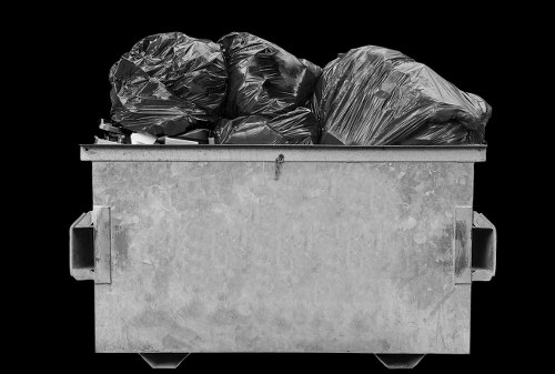 Waste collection vehicle and crew at a commercial site