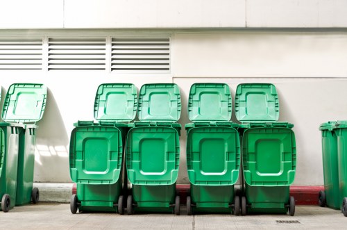 Technicians using equipment for builders waste clearance